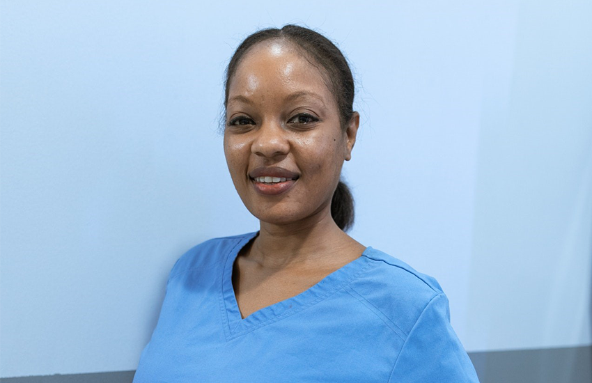 Friendly, middle-aged nurse in scrubs headshot