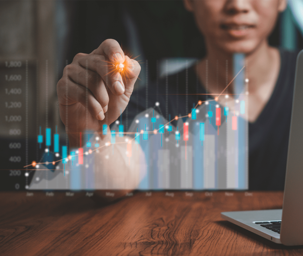 Female data scientist analyzes and plots data points on a candlestick chart