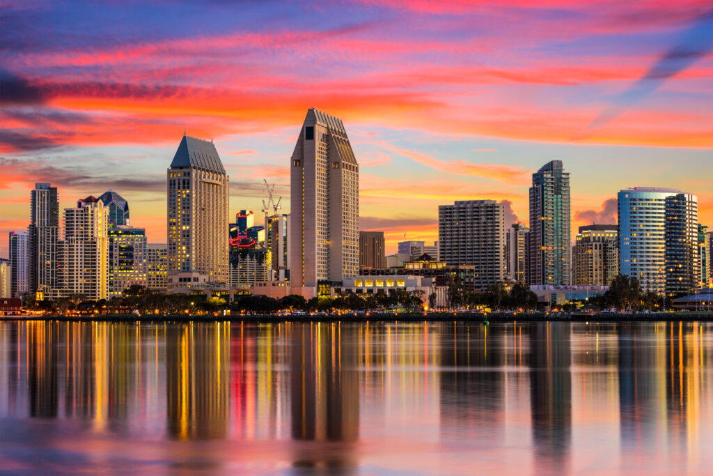 San Diego skyline illuminated by a vibrant sunset.